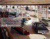 846-02794688em-1960s-INTERIOR-VIEW-OF-AUTOMOBILE-SHOWROOM-WITH-GLASS-WALLS-AND-RED-CA.jpg